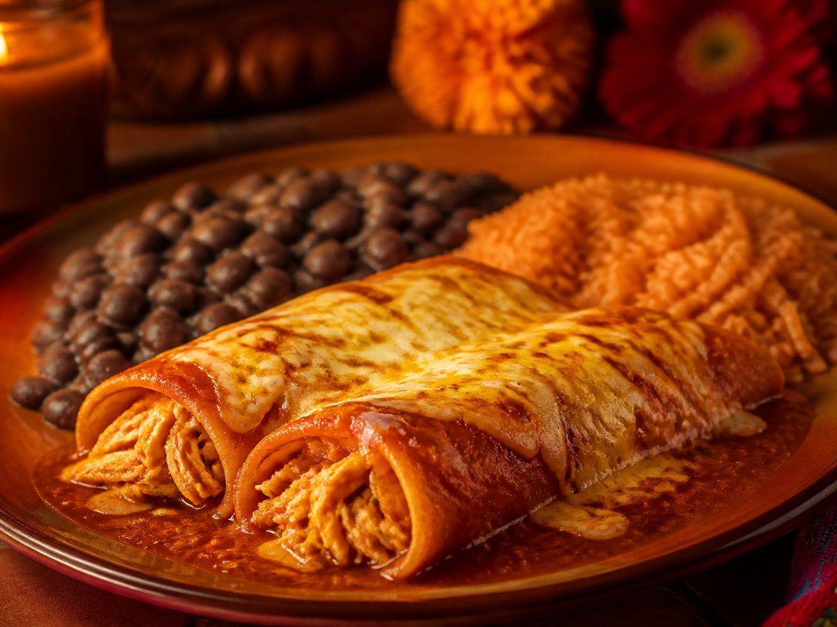 Chicken enchiladas with rice and beans